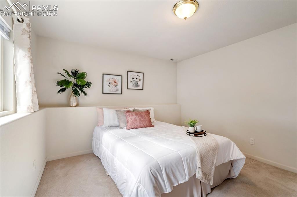 Image 19 of 36: Bedroom with carpet