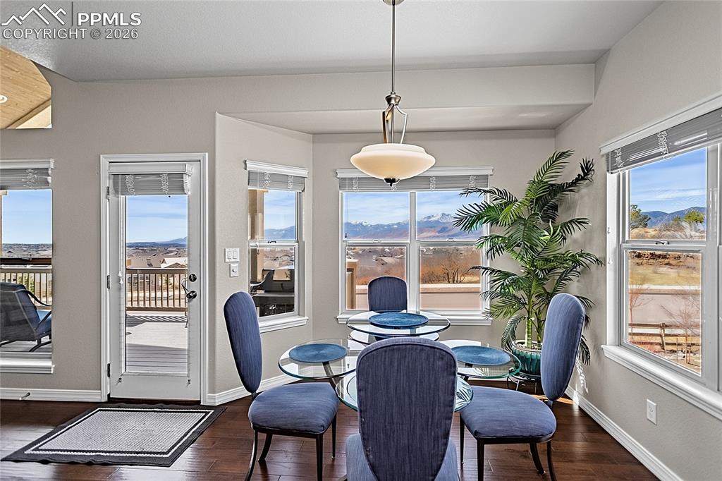 Image 16 of 50: Dining area allows you to stay warm inside or can lead you to the upper bac