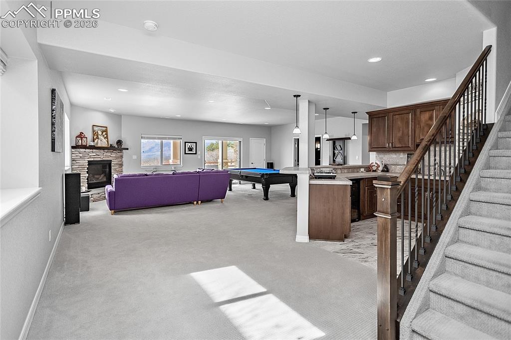 Image 28 of 50: The high ceilings allow plenty of light through the basement. Stay cozy by 