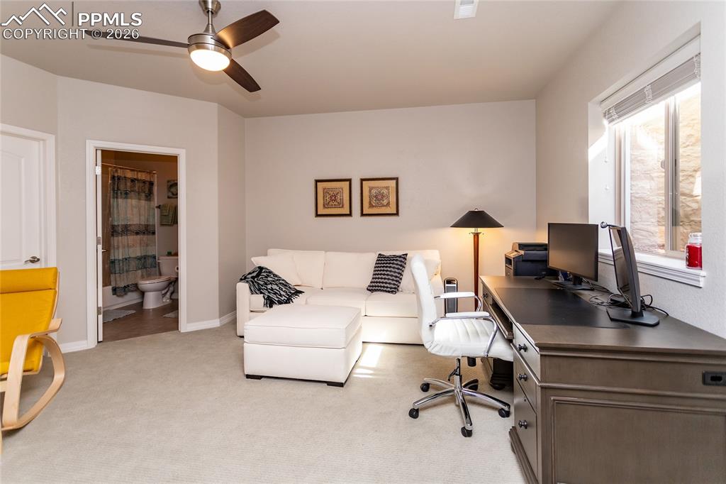 Image 36 of 50: Third bedroom suite with private full bathroom and walk-in closet