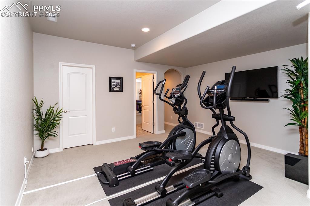 Image 40 of 50: Double-sink basement bathroom adjoins to hall & fourth bedroom