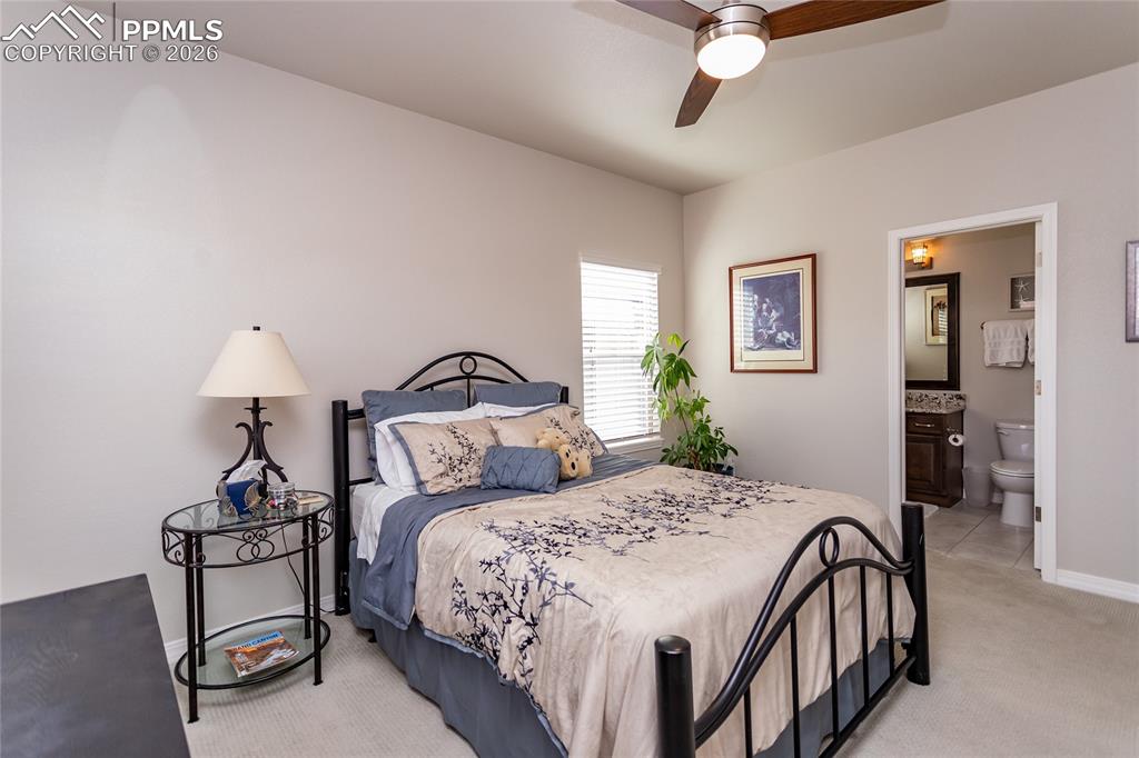 Image 6 of 50: Front bedroom suite with private full bathroom and walk-in closet