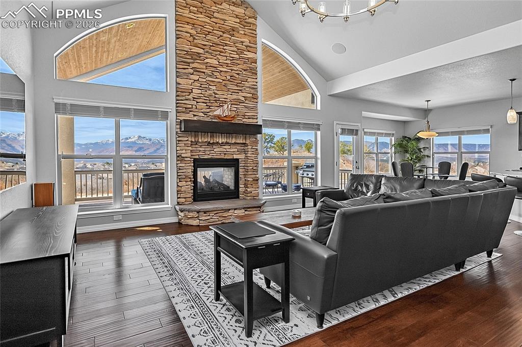 Image 9 of 50: Stay warm with the double-sided gas fireplace in either the Great Room or o