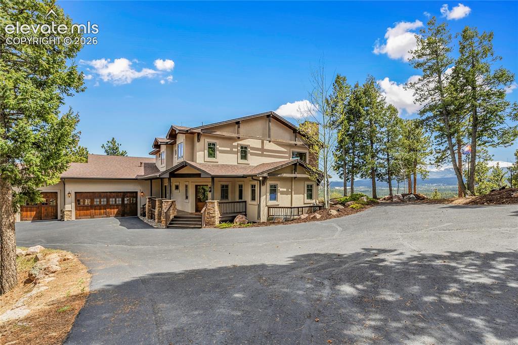 Image 1 of 36: Stunning custom mountain home situated on a private ridge with panoramic vi