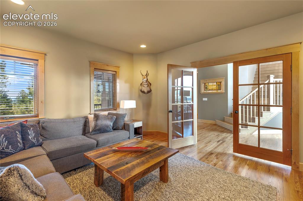Image 25 of 36: Versatile bonus room with elegant French doors!
