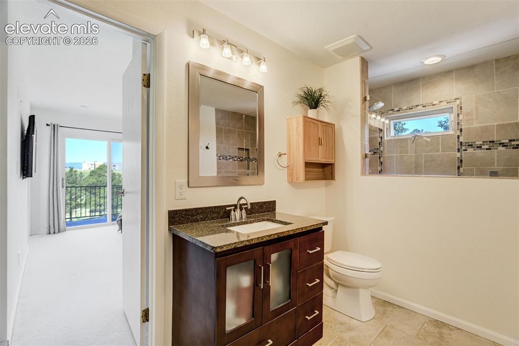 Image 23 of 50: Primary bedroom, Neutral-toned room featuring light beige walls and carpeti