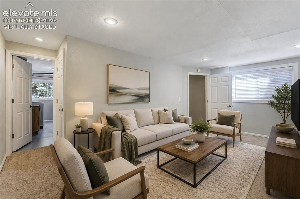 Image 36 of 50: Carpeted room with recessed lighting and light-colored walls