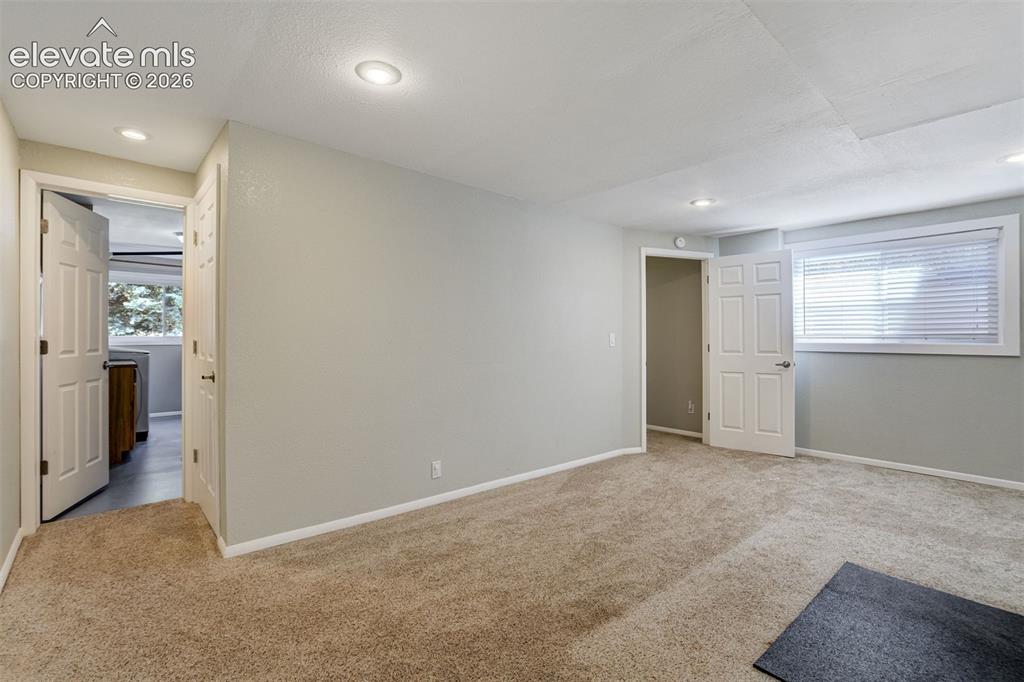 Image 37 of 50: Virtually Staged Living area featuring recessed lighting, light-toned walls