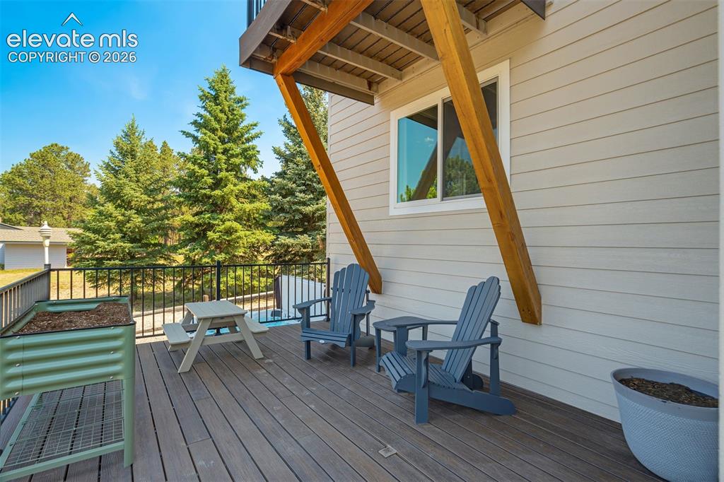 Image 40 of 50: expansive composite deck wraps around