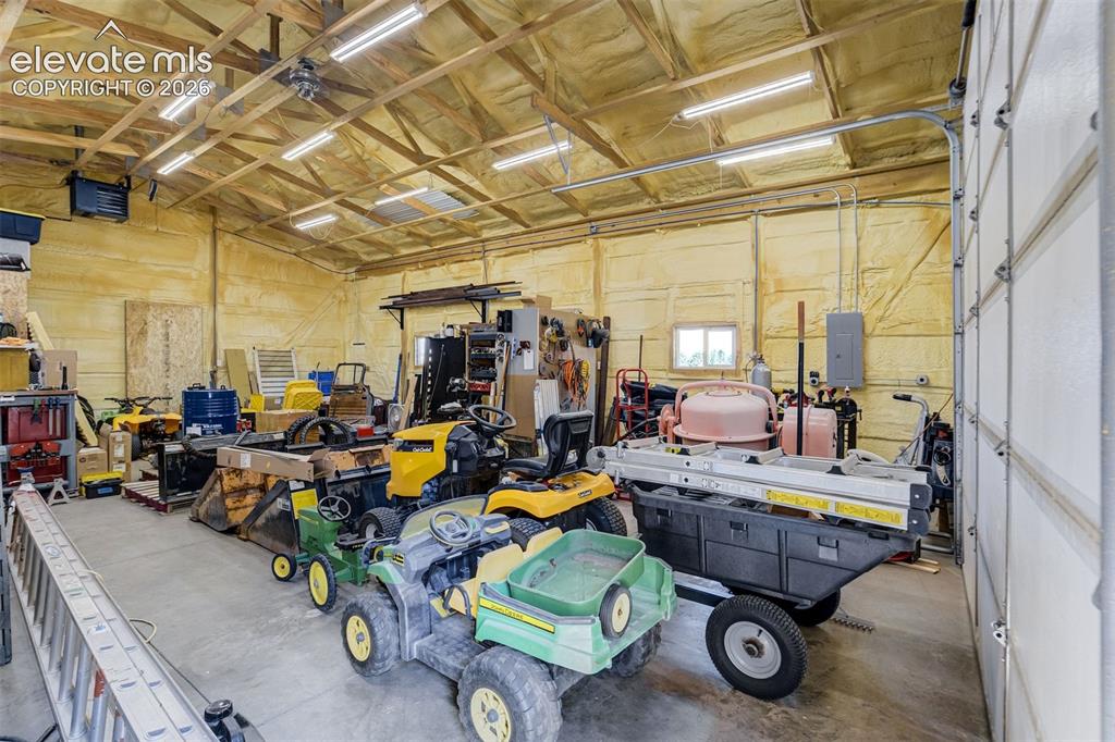 Image 47 of 50: 30x40 ft shop with large roll up door, interior office, heated, concrete fl