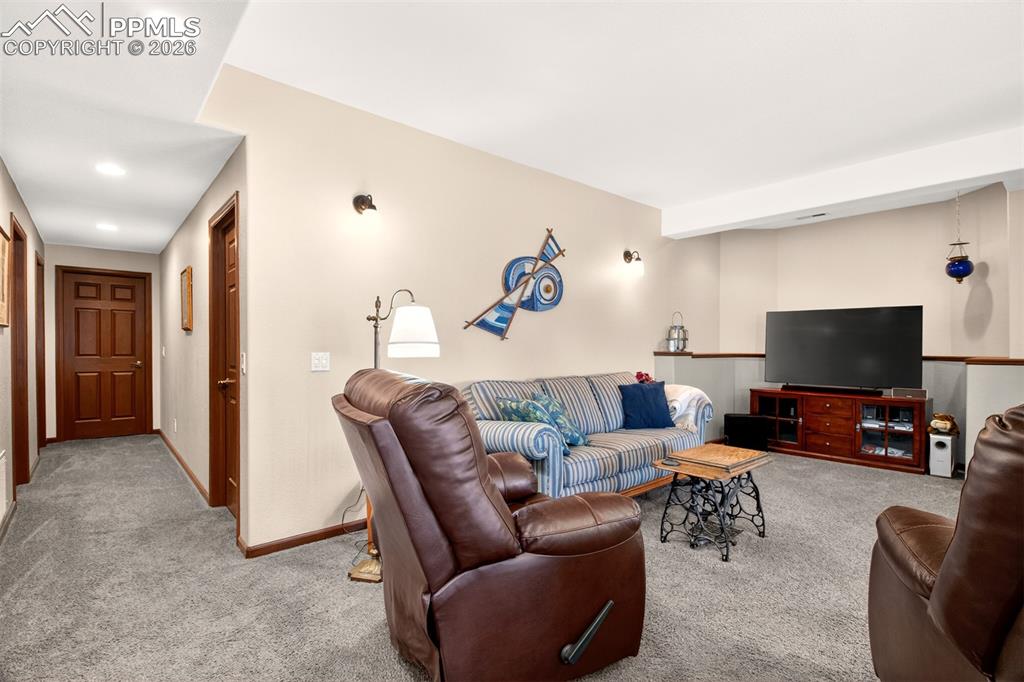 Image 35 of 49: Hall of Doors Lead To Unfinished Basement. (Designed for 3 Additional Bedro