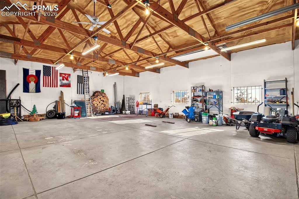 Image 39 of 49: Lights, Ceiling Fan, Stove for Winter Heat.