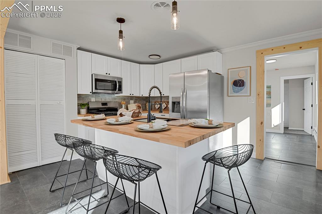 Image 5 of 24: Gorgeous updated kitchen with stainless appliances