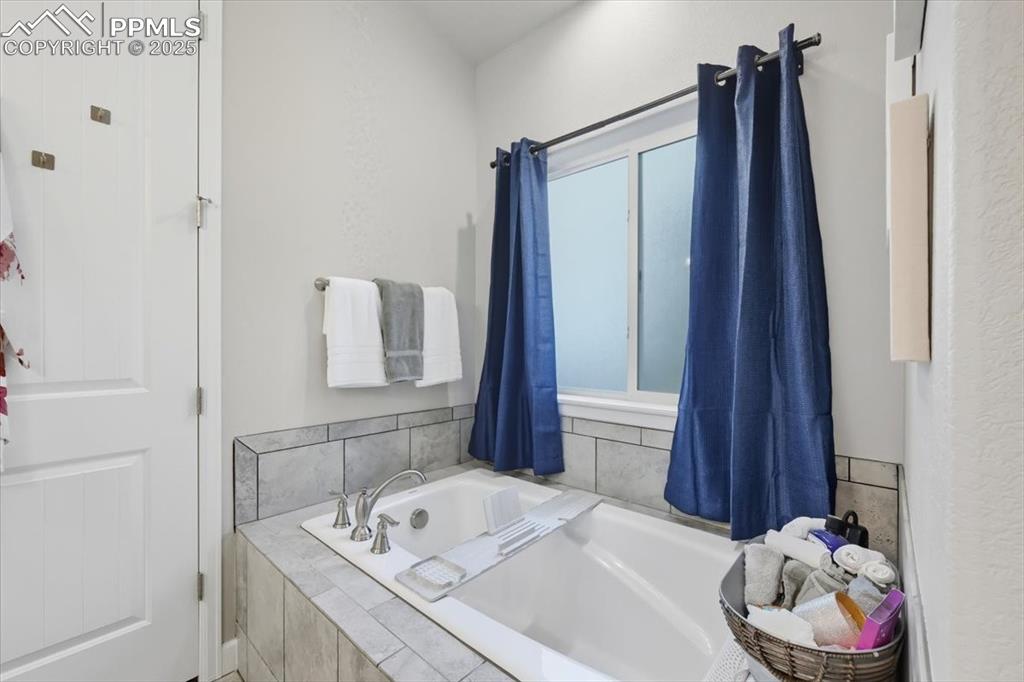 Image 25 of 47: Bathroom with a garden tub