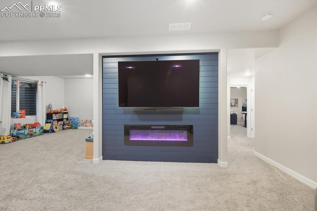 Image 31 of 47: Detailed view of downstairs fireplace