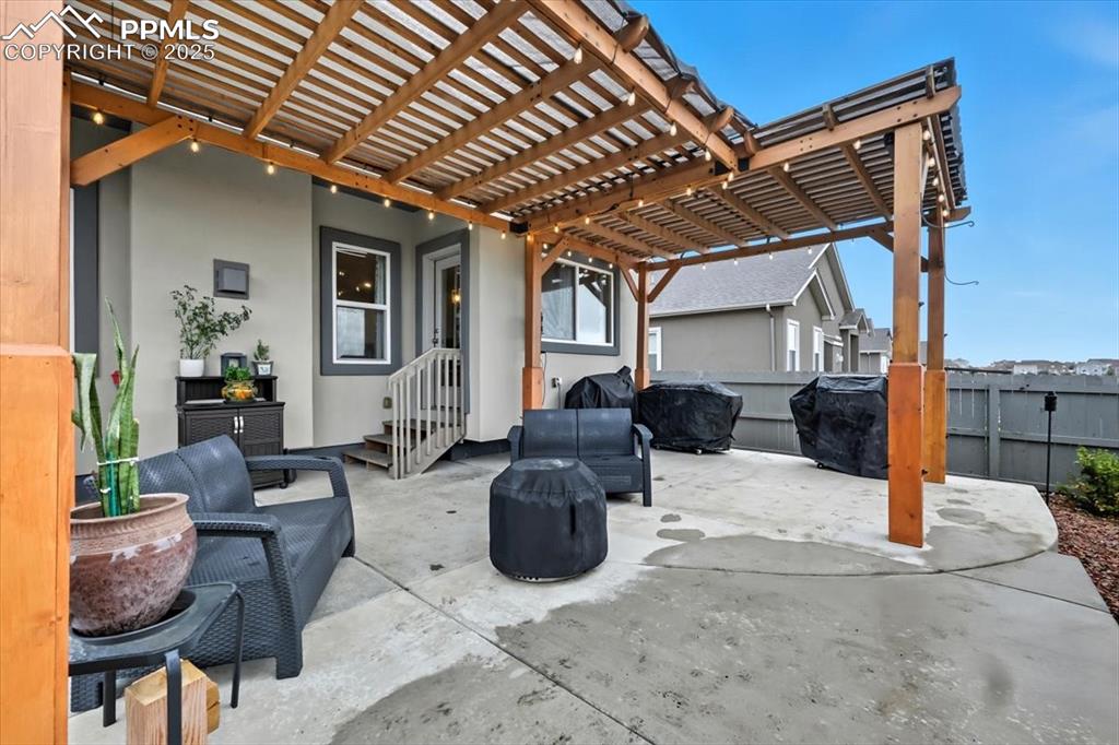 Image 41 of 47: View of patio with a pergola, grilling area, and an outdoor hangout area