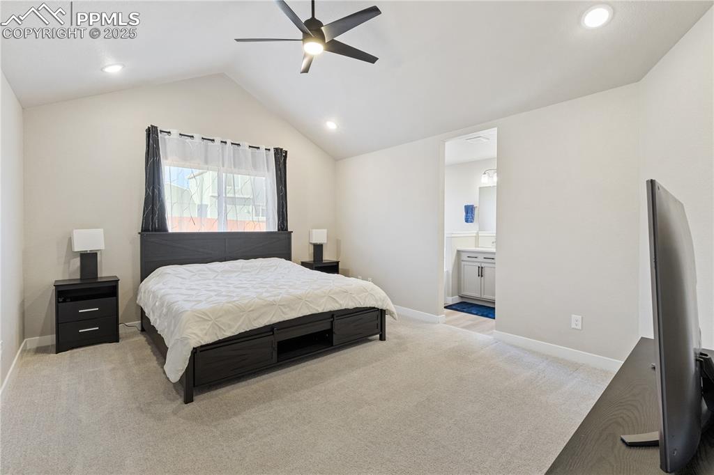 Image 3 of 46: Bedroom, vaulted ceiling, ceiling fan, recessed lighting, and connected bat