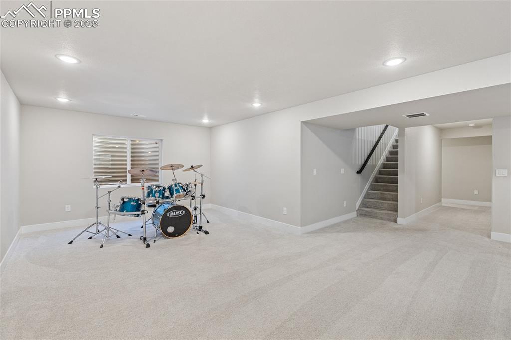 Image 31 of 46: Playroom featuring light carpet and recessed lighting