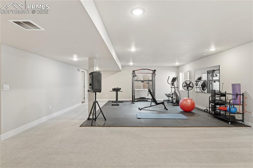 Image 32 of 46: Workout room with recessed lighting and carpet flooring