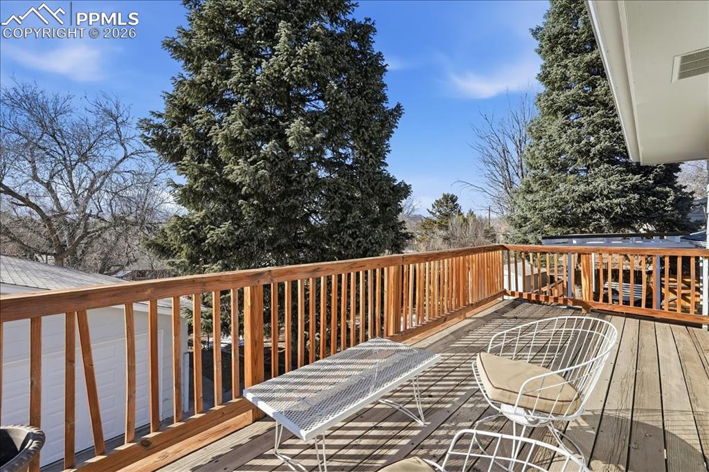 Image 14 of 28: Walk out upper patio from primary bedroom