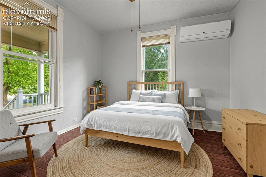 Image 18 of 50: main level bedroom, virtually staged