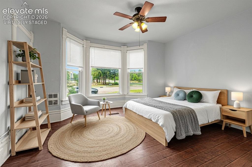 Image 19 of 50: main level bedroom, virtually staged