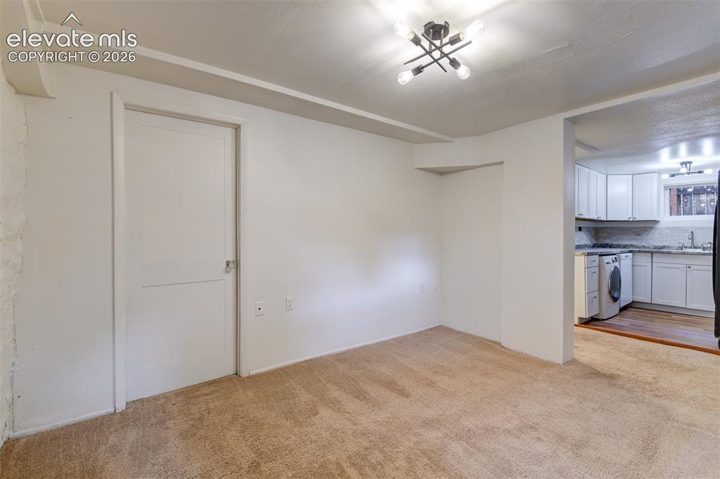 Image 33 of 50: Basement unit located in the back of the property