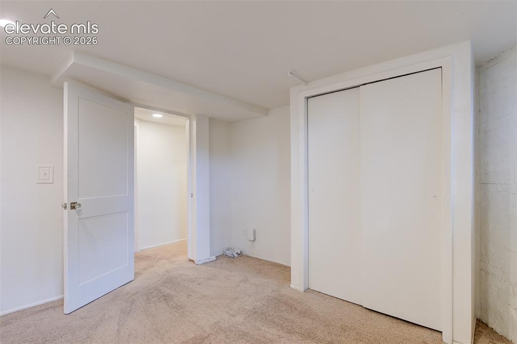 Image 39 of 50: Basement unit located in the back of the property 
