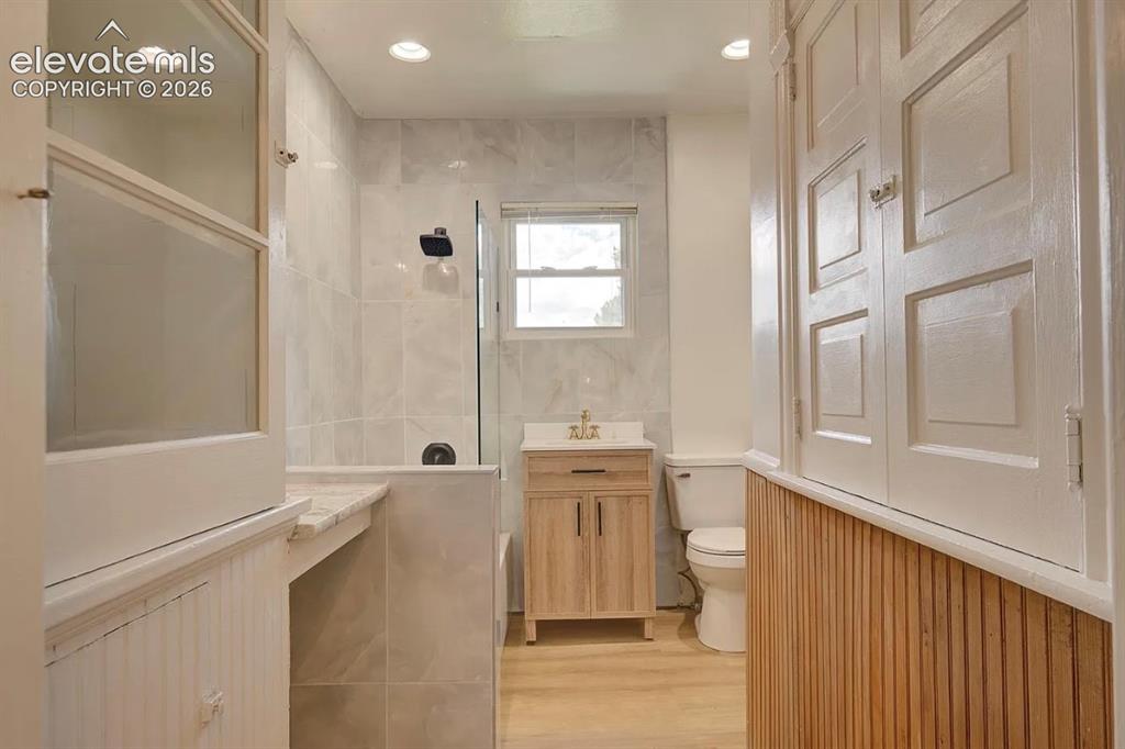 Image 6 of 50: Upper level unit, modern remodeled bathroom