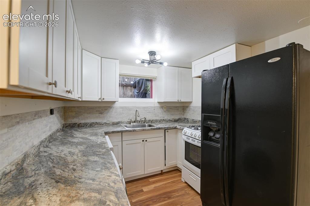 Image 7 of 50: Basement unit located in the back of the property