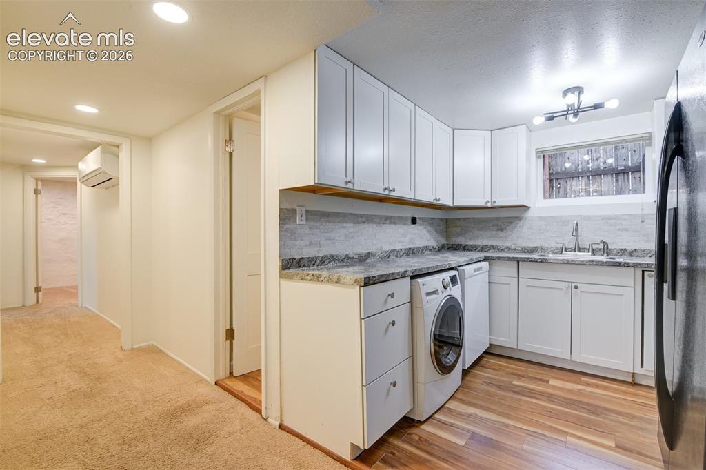 Image 8 of 50: Basement unit located in the back of the property