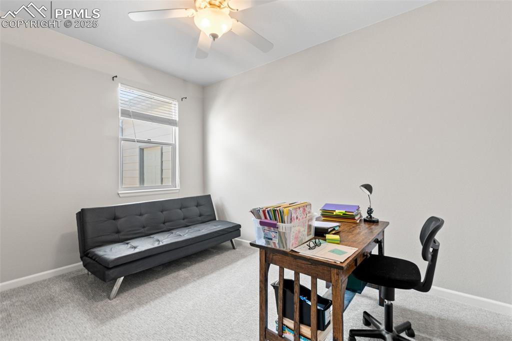 Image 26 of 39: Carpeted office space featuring baseboards