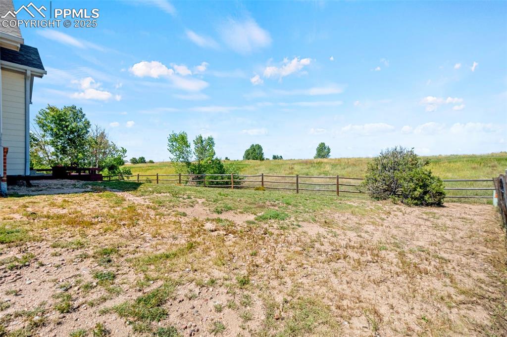 Image 35 of 39: View of yard featuring a view of rural / pastoral area