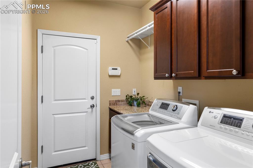 Image 15 of 43: Main level laundry/mud room off the garage. 