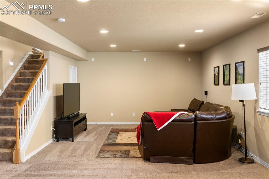 Image 24 of 43: Finished basement with spacious family room. 