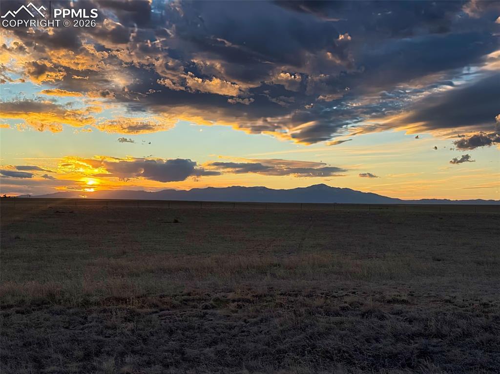Image 11 of 13: Mountain Sunset View – Striking sunset colors stretching across the horizon