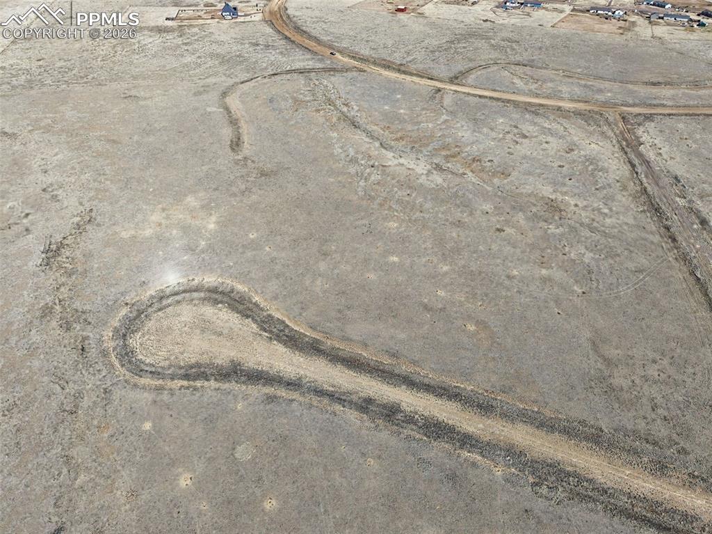 Image 6 of 13: Aerial Turnaround View – Drone perspective showing a graded road to the cul