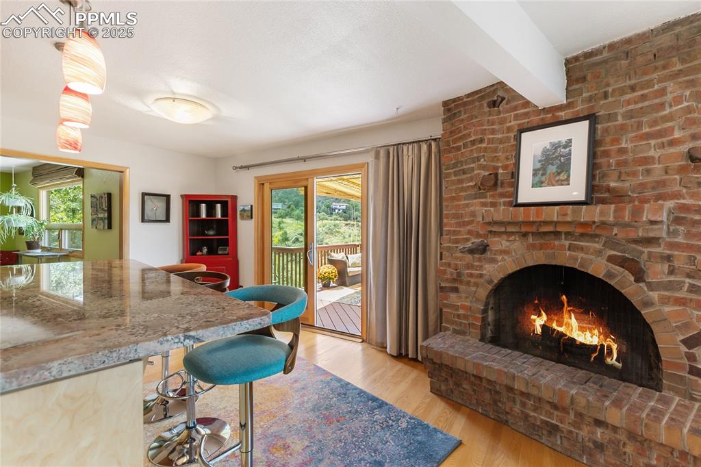Image 19 of 40: Kitchen corner with fireplace