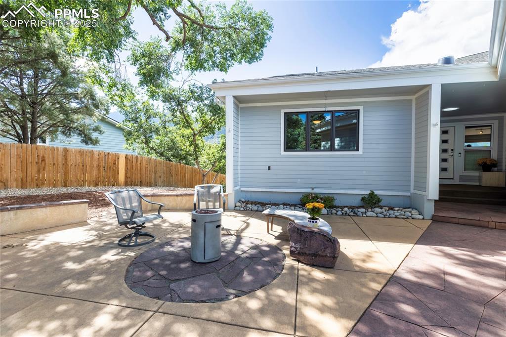 Image 3 of 40: Front patio with custom bench