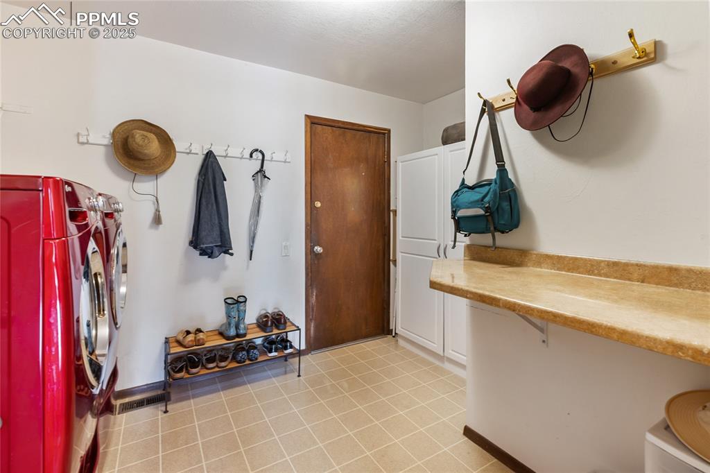Image 31 of 40: Main Level Laundry room goes to garage