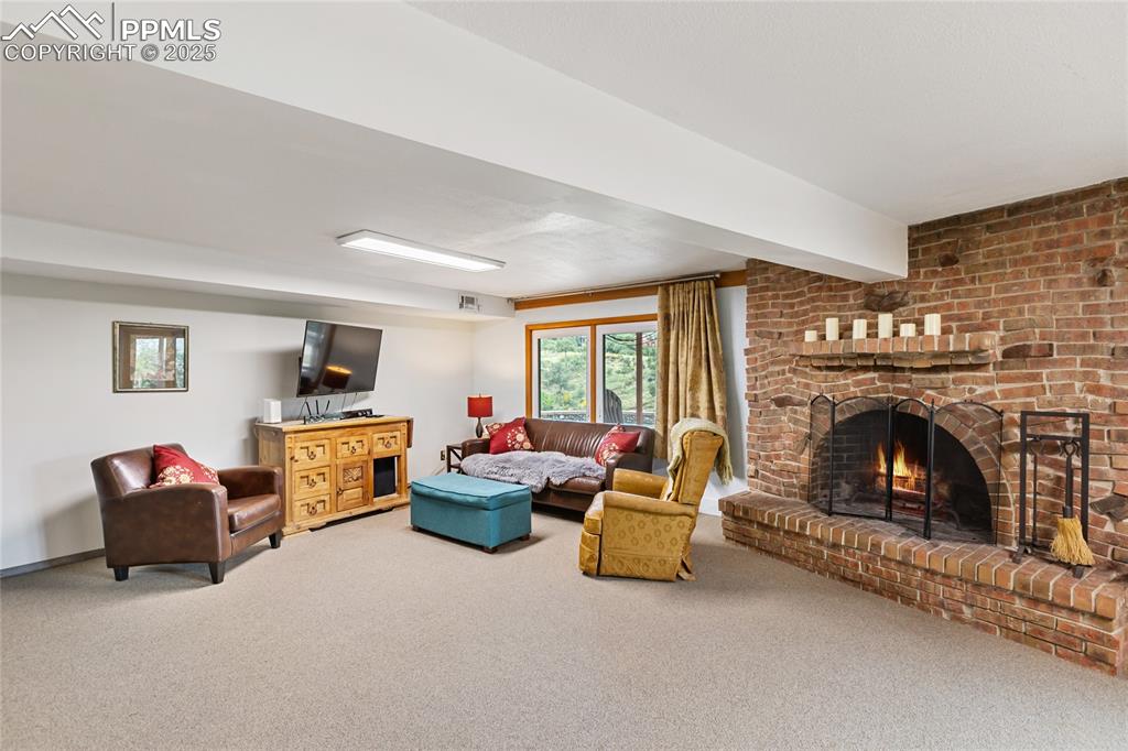 Image 34 of 40: Lower level living room