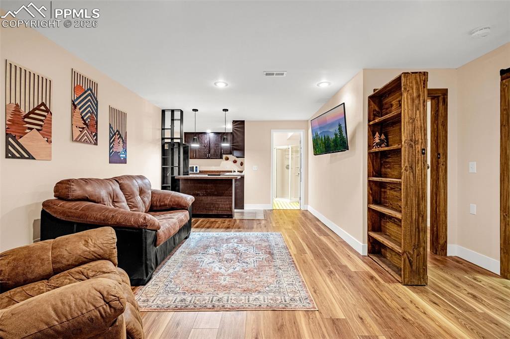 Image 23 of 39: Another rare find; mother-in-law casita in the basement level locks off to 