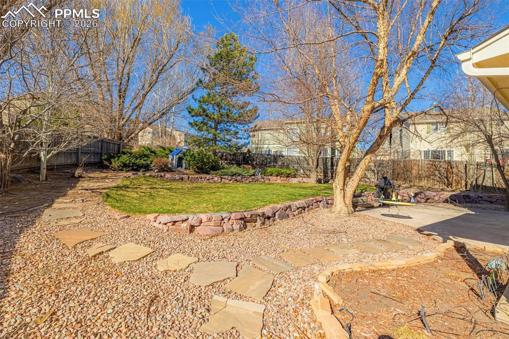 Image 30 of 39: Leveled area unique for gardening or children