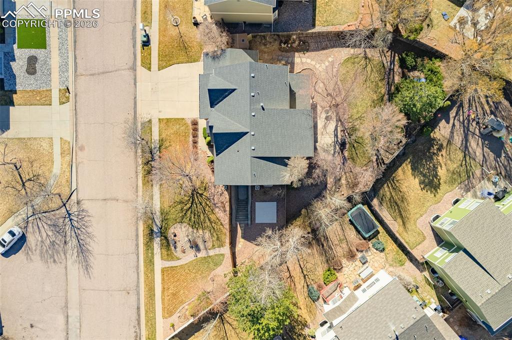 Image 35 of 39: Well placed on lot with surrounding trees and foliage