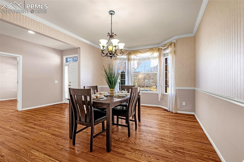 Image 8 of 39: Formal dining area spaciously can accommodate large table and sidebar furni