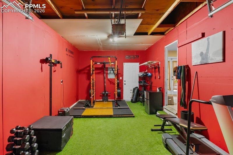 Image 18 of 20: Garage gym- can be returned to car garage