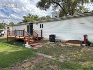 Image 5 of 9: Wood deck with coordinating wood railings and steps