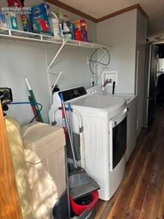 Image 9 of 9: Laundry area featuring wood-finish flooring and a built-in wire shelving un