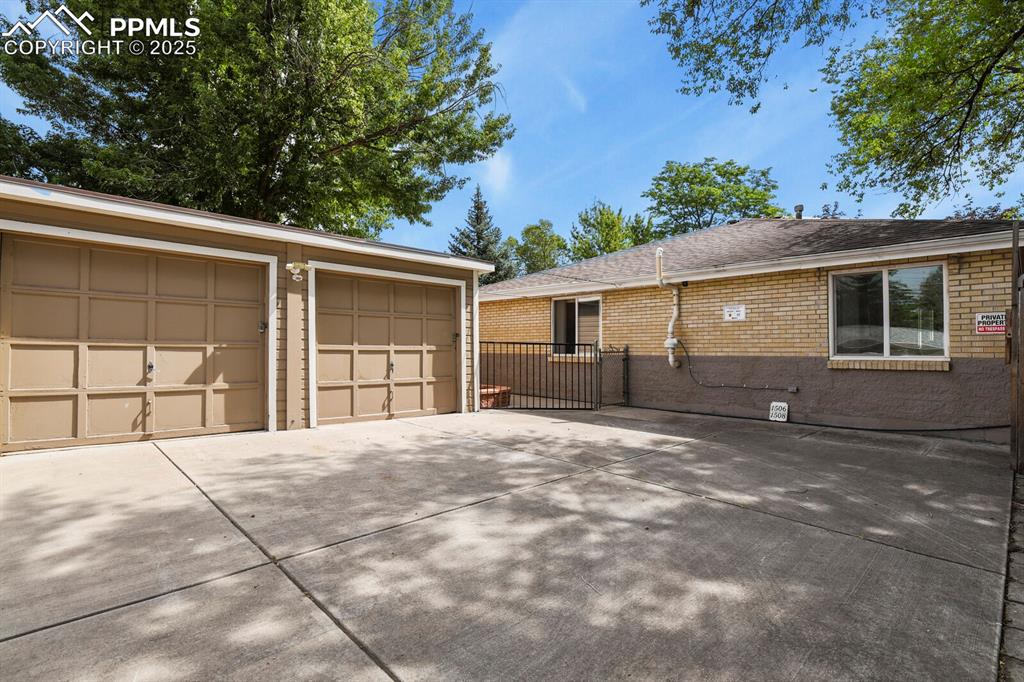 Image 36 of 47: Two car garage off the back alleyway with additional parking