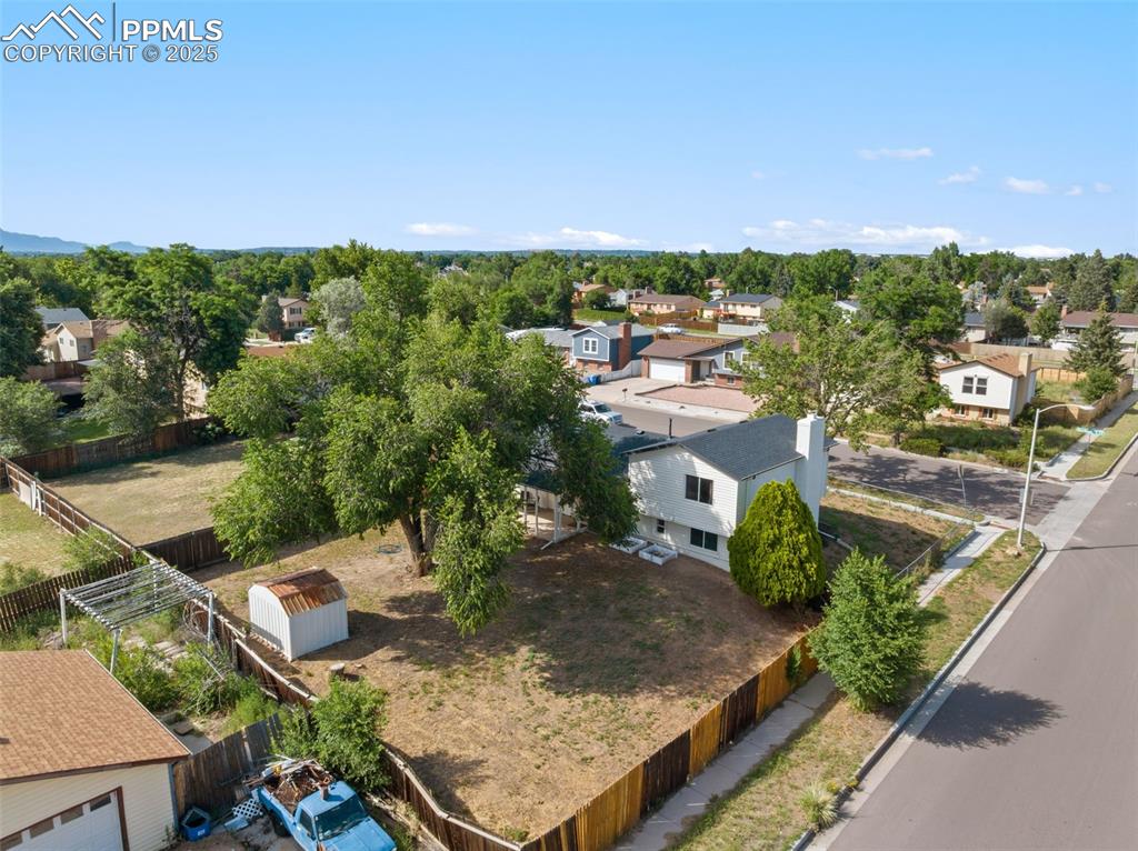 Image 24 of 24: Aerial view of large corner lot and backyard.